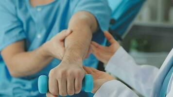 Physiotherapist instructing the patient during exercise video