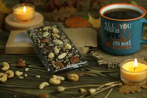 Homemade chocolate with cup of coffee and nuts photo