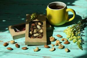 Homemade chocolate with cup of coffee and nuts photo