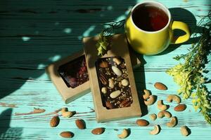 Homemade chocolate with cup of coffee and nuts photo