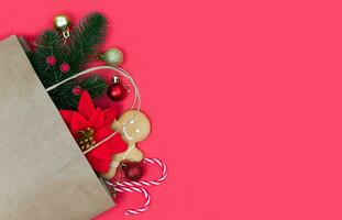 Festive winter composition with Christmas gifts on a red background. Copy space. Flatlay. Top view. Close-up. photo