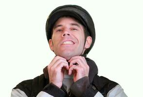 Bicyclist Adjusts Helmet Straps Before a Ride photo