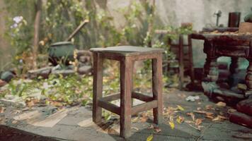 A lonely wooden stool in an abandoned room, capturing the devastation and decay photo