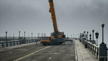 big auto crane on the bridge under constraction photo