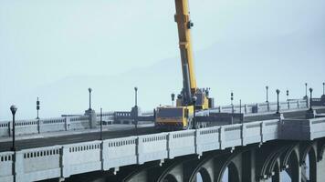 big auto crane on the bridge under constraction photo