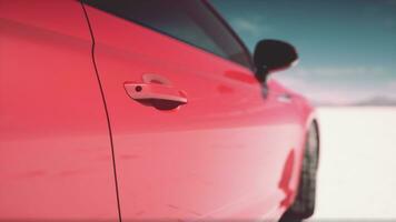 red sport car on the salt lake photo