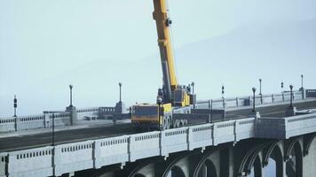 big auto crane on the bridge under constraction photo