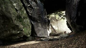 Empty road goes through the cave with glowing end photo