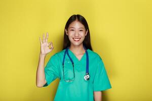 Portrait of a beautiful young woman in a yellow background, photo