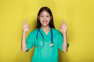 Portrait of a beautiful young woman in a yellow background, photo