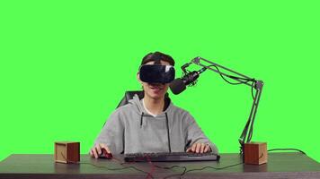 POV of vlogger using virtual reality to stream live gaming battle while sitting at his workstation, playing web challenge. Male streamer recording interactive broadcast using vr headset. video