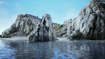 Tropical rock island against blue sky and sea photo