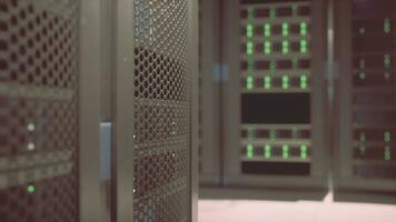 Shot of Corridor in Working Data Center Full of Rack Servers and Supercomputers photo