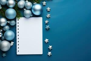 AI generated Christmas blue background with blank paper and blue metallic decorations on a table. Top view photo