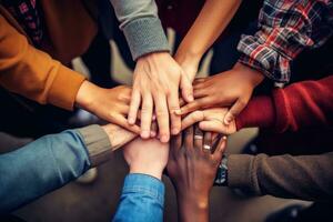 AI generated Group of diverse people putting their hands together on top of each other, A group of diverse hands holding each other in support, teamwork aerial view, AI Generated photo