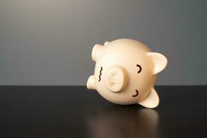 Sick pig piggy bank. Bad economy. Medicine and healthcare. Financial crisis, end of savings, bankruptcy. Devaluation, inflation. Impoverishment. Refinancing restructuring of debts. Economic depression photo