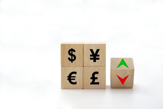 The exchange rate icon on wooden block cubes and arrows show lowering and increasing according to the index exchange rate. photo