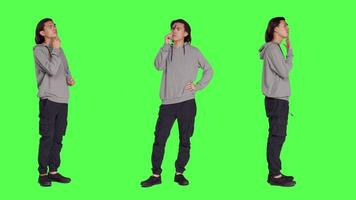 Young thinker acting uncertain on camera, thinking about question and putting his concentration on new perspective. Adult being doubtful and confused, pondering over greenscreen template. video