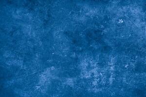 Old wall pattern texture cement blue dark abstract  blue color design are light with black gradient background. photo
