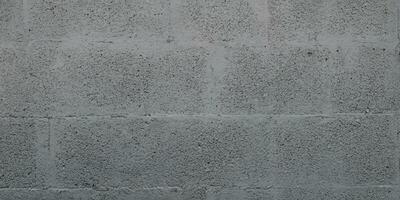 Grey cinderblock brick wall for background gray blockwork texture photo