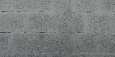 Grey cinderblock brick wall for background gray blockwork texture photo