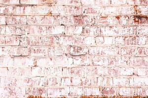 Unusual bright saturated abstract pink background from old brick wall in retro style photo