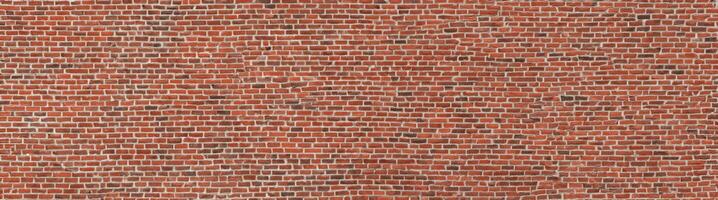 Red brick wall. Texture of old dark brown and red brick wall panoramic backgorund. photo