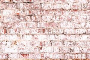 Unusual bright saturated abstract pink background from old brick wall in retro style photo