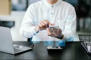 Businessman working with smart phone and laptop and digital tablet computer in office with digital marketing media in virtual icon photo