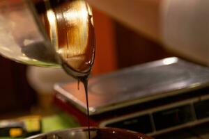 Chocolatier Pouring Chocolate photo