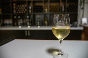 Glass of white wine photo