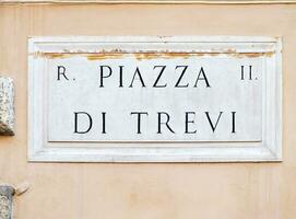 Piazza di Trevi street plate in Rome, Italy, Landmark of Rome, Close-up view of Piazza di Trevi street sign photo