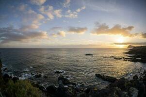 Sunset over the ocean photo