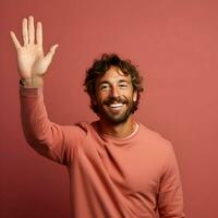 AI generated Photo of the smiling man waving his hand on a pink background. High quality. AI Generative