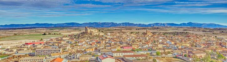 Drone panorama of the village of Almudevar in northern Spain with the Pyrenees in the background photo