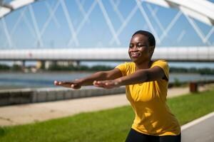 Young woman enjoys exercising outdoor photo