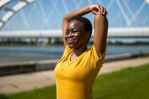 Young woman enjoys  exercising outdoor photo