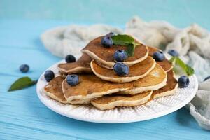 Pancakes with honey and blueberries. Sweet homemade pancakes photo