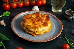 Classic lasagna with minced chiken bolognese sauce and bechamel sauce photo