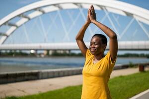 Young woman enjoys meditating outdoor. photo