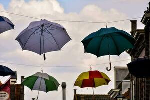 umbrellas hanging from the wires photo