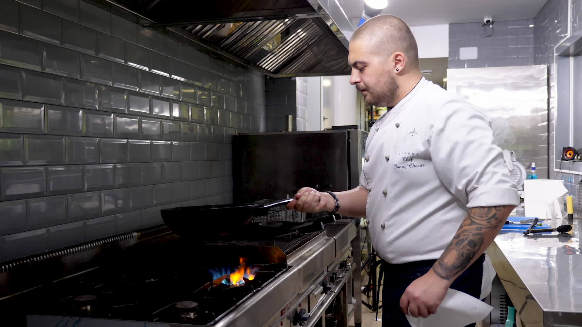 Cook frying seafood and shrimps in a pan in restaurant kitchen 35033479