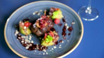Beef meat steack with sweet berries on a plate on restaurant table video