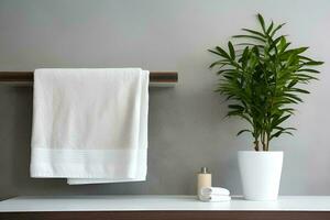 ai generado blanco spa toalla con planta y envase en blanco mesa foto