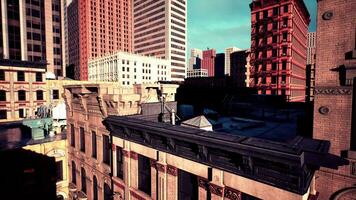 cityscape at sunset, with the roofs of tall buildings in full view photo