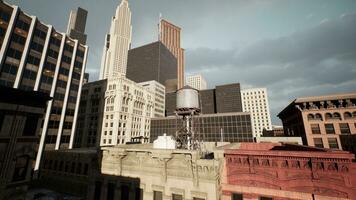 rooftops of its tallest buildings as the sun sets photo