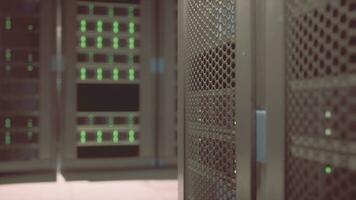 Shot of Corridor in Working Data Center Full of Rack Servers and Supercomputers photo