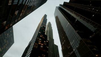 Bottom view of modern skyscraper in business district photo