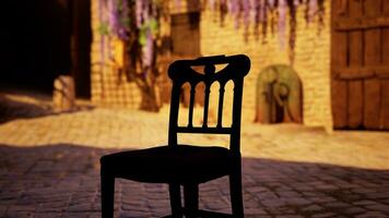 A black chair sitting on top of a brick floor photo