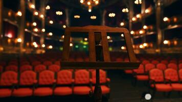 An empty auditorium with red seats and lights photo